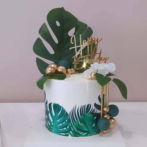 Création d'un gâteau et gourmandises sur le thème feuilles tropicales et doré à Vert Saint-Denis (77)